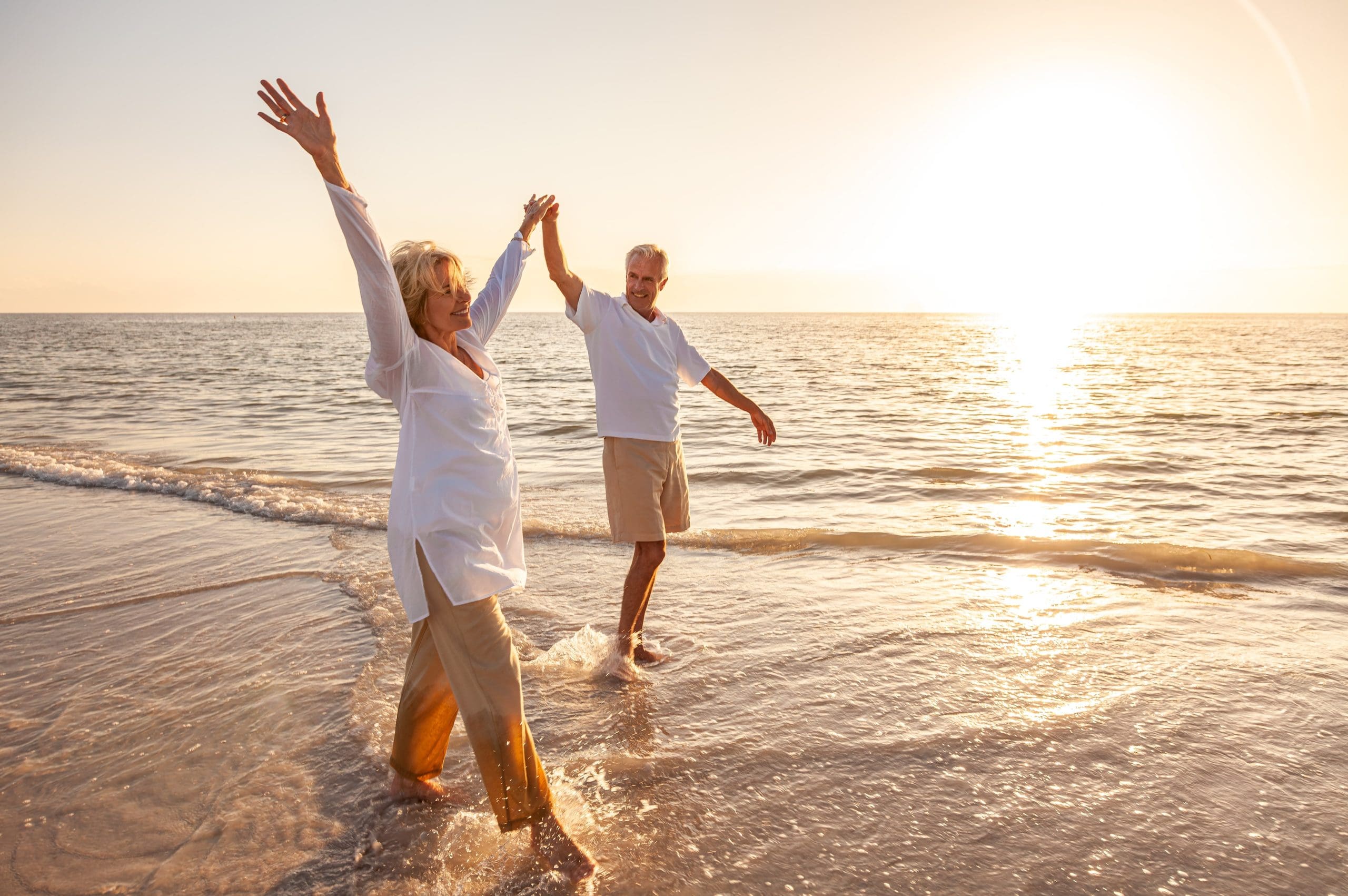 Couple on the beach enjoying retirement